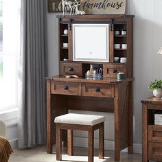 a wooden desk with a mirror and stool