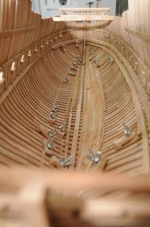 a close up view of the inside of a wooden boat