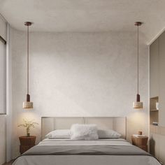 a bed with two lamps hanging from it's sides in a room that has white walls and wood flooring