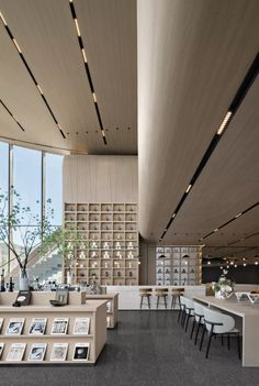 the inside of a restaurant with tables and chairs