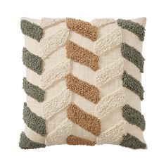 a white pillow with green, brown and beige stripes on the front is made out of yarn