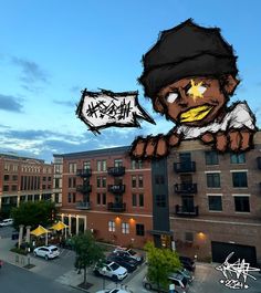 an image of a cartoon character on the side of a building with a speech bubble above it