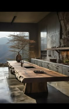 a large wooden table sitting in the middle of a kitchen next to an open window