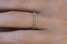 a woman's hand with a ring on it