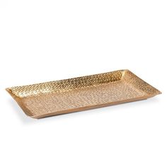 a gold tray with an intricate design on the bottom and sides, it is sitting on a white surface