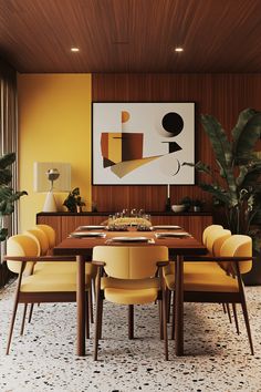 a dining room table with yellow chairs and a large painting on the wall above it