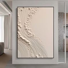 an abstract painting on the wall in a living room