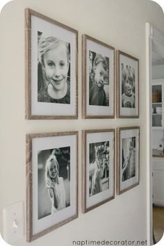 a wall with four pictures hanging on it