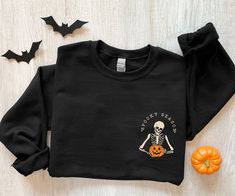 Spooky Season sweatshirt, minimal Halloween sweater, Skeleton pocket sweatshirt, Skeleton graphic sweatshirt, halloween pajamas, tshirt A sturdy and warm sweatshirt bound to keep you warm in the colder months. Our Gildan crewneck sweatshirts are a nice, soft and comfy midweight sweatshirt. The perfect sweatshirt for everyday wear and cozy for those cold nights. * 50% cotton, 50% polyester * Pre-shrunk * Classic fit * 1x1 athletic rib knit collar with spandex * Air-jet spun yarn with a soft feel Skeleton Graphic, Halloween Pajamas, Halloween Tattoo, Pumpkin Sweatshirts, Cat Lover Shirt, Halloween Sweater, Sweatshirt Halloween, Cat Sweatshirt, Selling Clothes