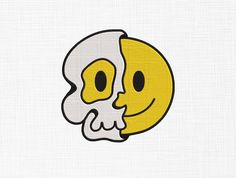 a yellow and white skull with a smile on it's face