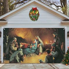 a christmas scene painted on the side of a garage