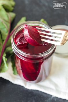 pickled beets in a mason jar with a fork sticking out of it and the text overlay reads how to make pickled beets