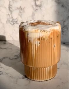 an iced drink sitting on top of a marble counter