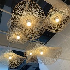 the lights are hanging from the ceiling in the office building, which has been decorated with intricate designs