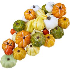 small pumpkins and gourds are arranged together