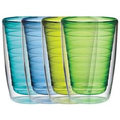 four different colored glass cups sitting next to each other