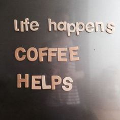 a sign that says life happens coffee helps