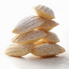 powdered sugar cookies stacked on top of each other in the shape of a pyramid