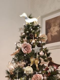 a small christmas tree decorated with ornaments and lights