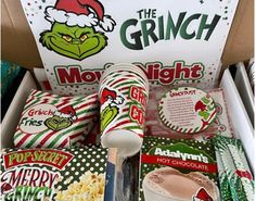 the grin movie box is packed with snacks and drinks for christmas party guests to enjoy