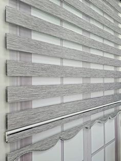 a close up of a window with blinds on it