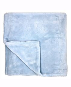 a blue blanket folded on top of a white background