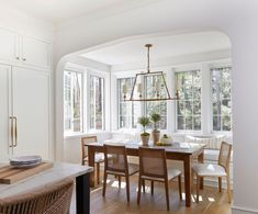 the dining room table is surrounded by chairs