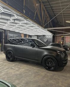 a range rover is parked in a garage