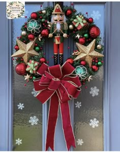 a christmas wreath with a nutcracker figure hanging from it's front door