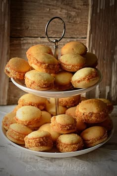 two tiered trays filled with pastries on top of each other