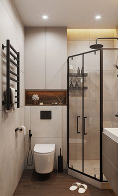 a bathroom with a toilet, sink and shower in it's center wall is shown