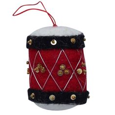 a red and black christmas ornament hanging from a string