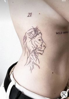 a woman's stomach with a small tattoo of a lion on her lower back