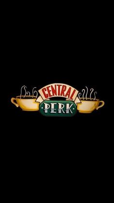 the central perk sign is lit up against a black background with green and yellow lettering