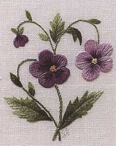 three purple flowers with green leaves on a white background in the cross stitch pattern,