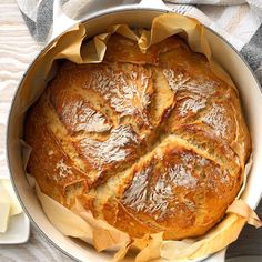 a loaf of bread sitting in a pan on top of a table