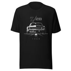 a black t - shirt with an image of a car on it's front