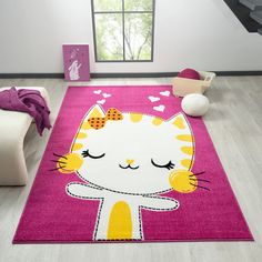 a pink rug with a white cat on it in a child's playroom