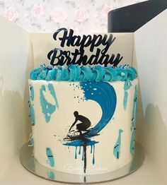 a birthday cake with a surfer on it