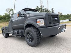 a large gray truck parked in a parking lot