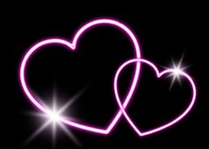 two heart shaped neon lights against a black background