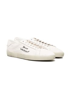 These Saint Laurent Court Classic sneakers are like a white canvas ready for any adventure, with a splash of style thanks to the side writing. They're laid-back yet effortlessly chic, perfect for a stroll downtown or a casual coffee date. Trust me, once you lace these up, you won’t want to take them off. Composed of 100% cotton with a rubber sole for comfort and durability. Crafted in Italy, ensuring top-notch quality and style. Distinctive side writing adds a unique touch. Lace-up design with a Saint Laurent Court Classic, Black Branding, Saint Laurent Sneakers, Embroidered Sneakers, New Trainers, Beige Sneakers, Embroidered Canvas, Saint Laurent Shoes, Leather Cap