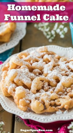 homemade funnel cake on a plate with powdered sugar and sprinkles around it