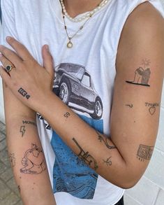 a person with tattoos on their arms