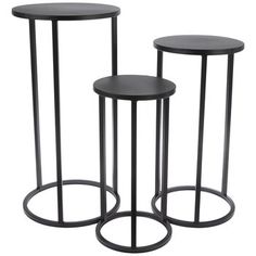 three black metal side tables on white background