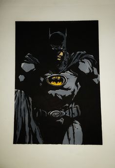 a batman painting is shown on the wall