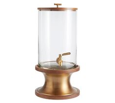 a gold faucet with a glass dome on top