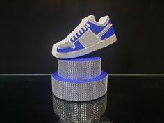 Centerpiece sneakers sweet 16 You need to choose the color of the stand. Choose a rhinestone color (gold or silver) SNEAKER ONE-SIDED The size------------------ Width -6,5 inches. Height 10 inches. ------------------------------ According to individual wishes, do not hesitate to contact me!! -------------------------------------------------------------------------------------- The manufacturing time is from 3 to 5 business days. The shipping time is approximately 7-14 business days within Europe, 3-5 weeks USA, Canada 3-5 weeks. The other parts of the world it's about 3-5 weeks. Thank you for visiting our store. Enjoy your wonderful holidays! Have a nice day! Sweet 16 Sneaker Ball Centerpieces, Sneakers Centerpiece, Sneaker Centerpiece Ideas, Sneaker Sweet 16, Sneaker Ball Centerpieces, Sneaker Ball Party Ideas, Sneakerball Party, Centerpieces Quinceanera, Super Sweet 16