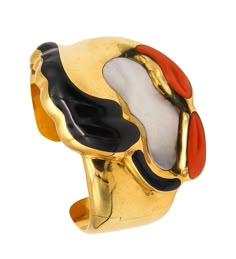 Abstract Cuff Bracelet designed by Elsa Peretti (1940-2021) for Tiffany & Co. Exceptionally rare sculptural piece, created in New York city by Elsa Peretti for the Tiffany Studios, back in the late 1970's. This is a one of a kind abstract cuff-bracelet, crafted in the shape of an escorpio in solid yellow gold of 18 karats, with high polished finish. Fitted in one side with an invisible tension hinge for sliding. Gemstones: Embellished with three free forms inlaid gemstones, carved from natural s Elsa Peretti Jewelry, Byzantine Jewelry, Dope Jewelry Accessories, Jewelry Tiffany, Tiffany Studios, Vintage Cuff Bracelet, Elsa Peretti, Dope Jewelry, Cabochon Ring