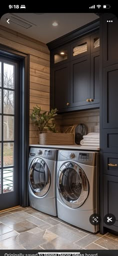 a washer and dryer in a room with wooden walls, windows, and tile flooring